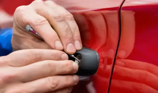 locksmith technician performing car lockout